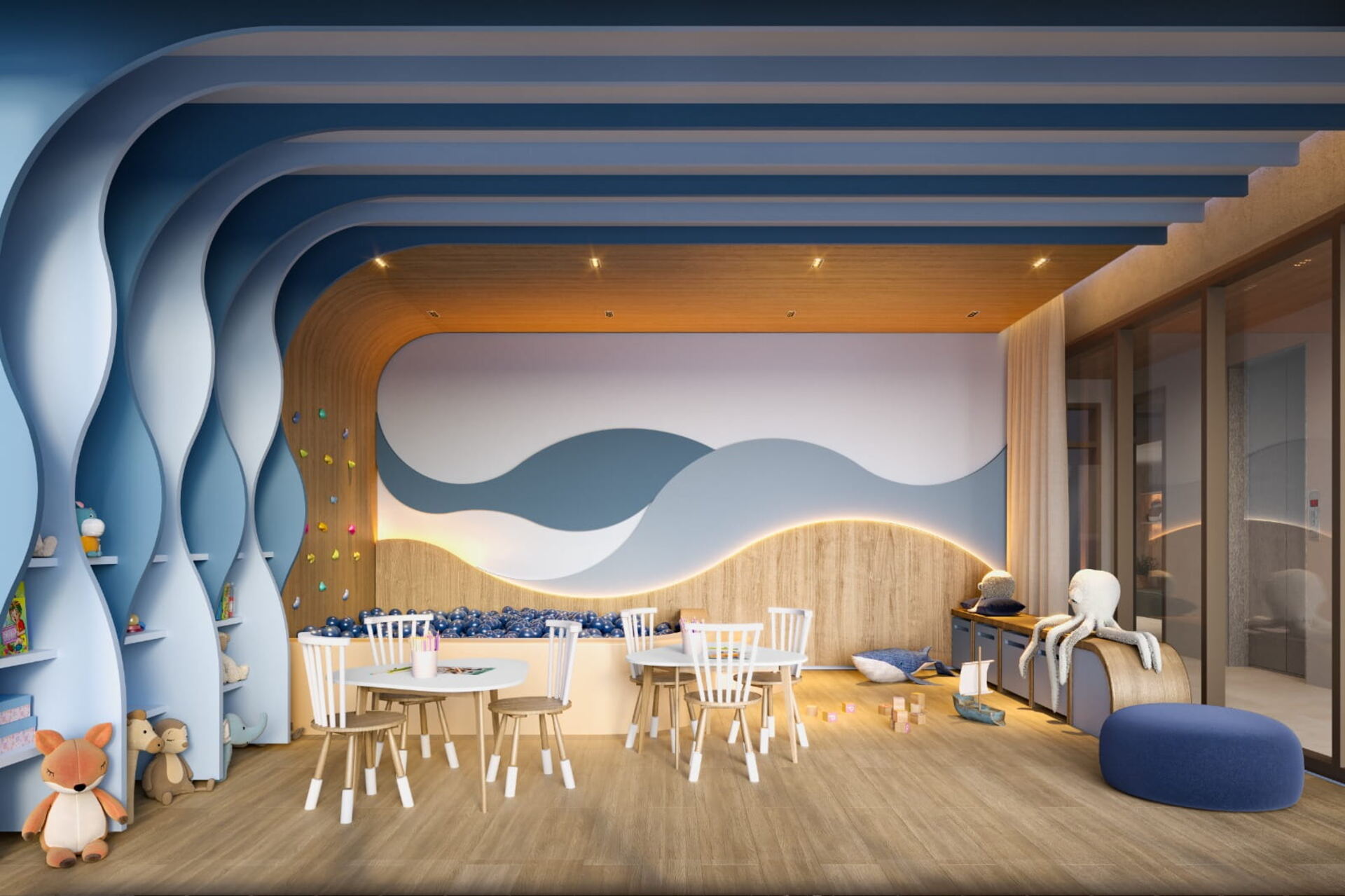 Espaço kids com piscina de bolinhas e parede de escalada